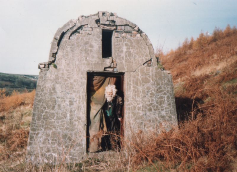 Old bloke in a hut.